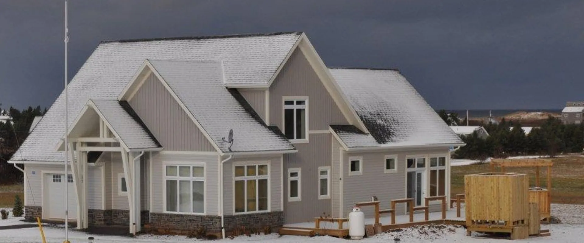 Finished craftsman-style cottage at Morell in the snow