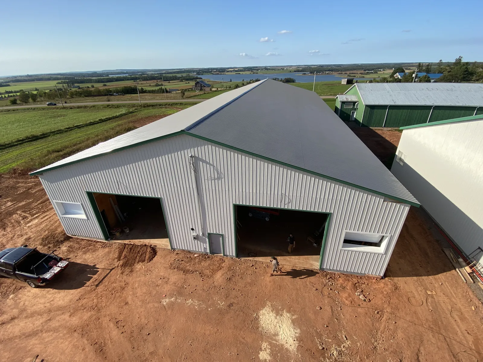 A finished BernMar farm building looking out over fields and water