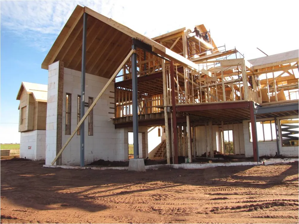 The French River home during the build, steel and timber frame standing on the foundation