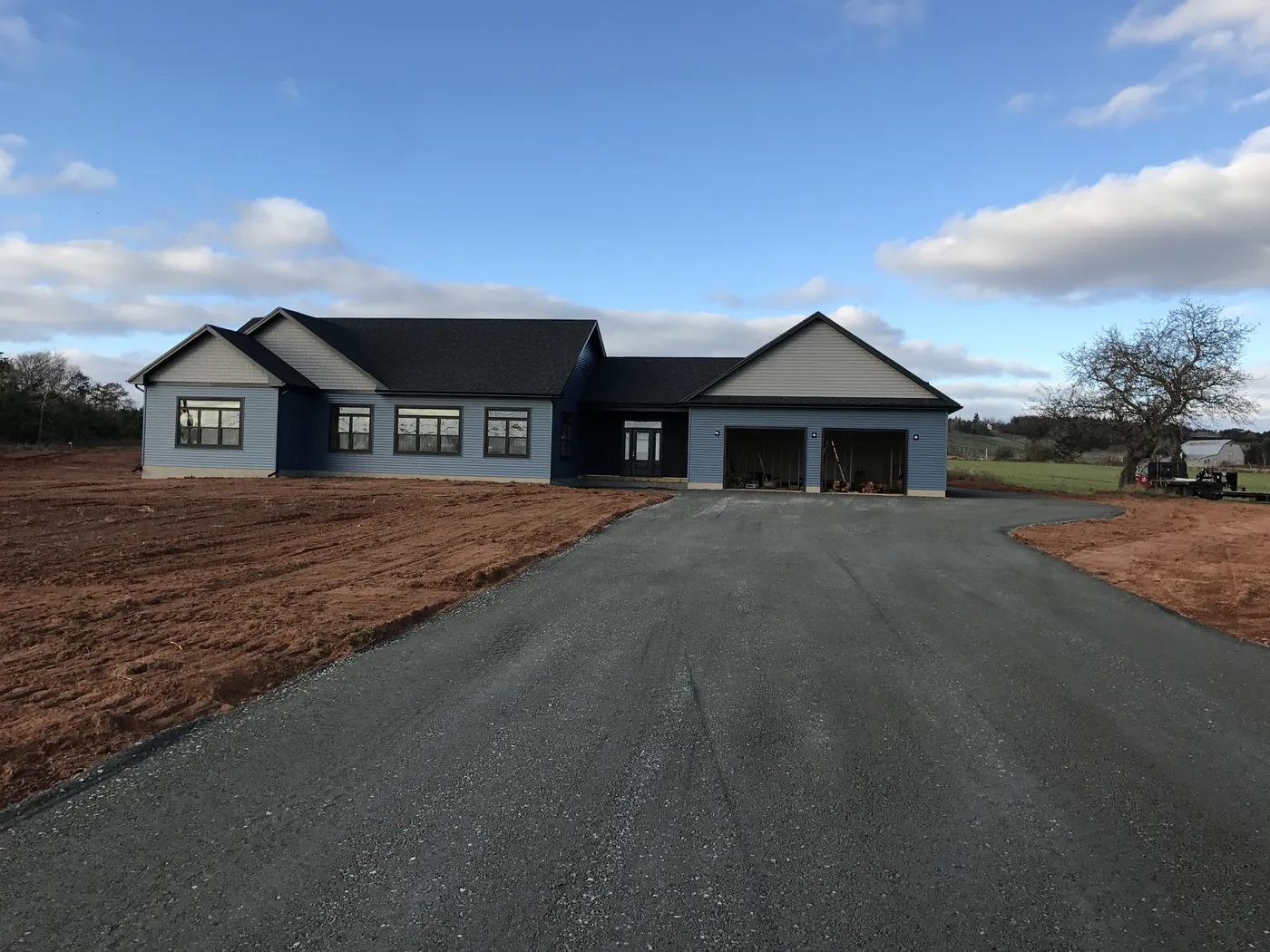 The finished Pownal home with its driveway in