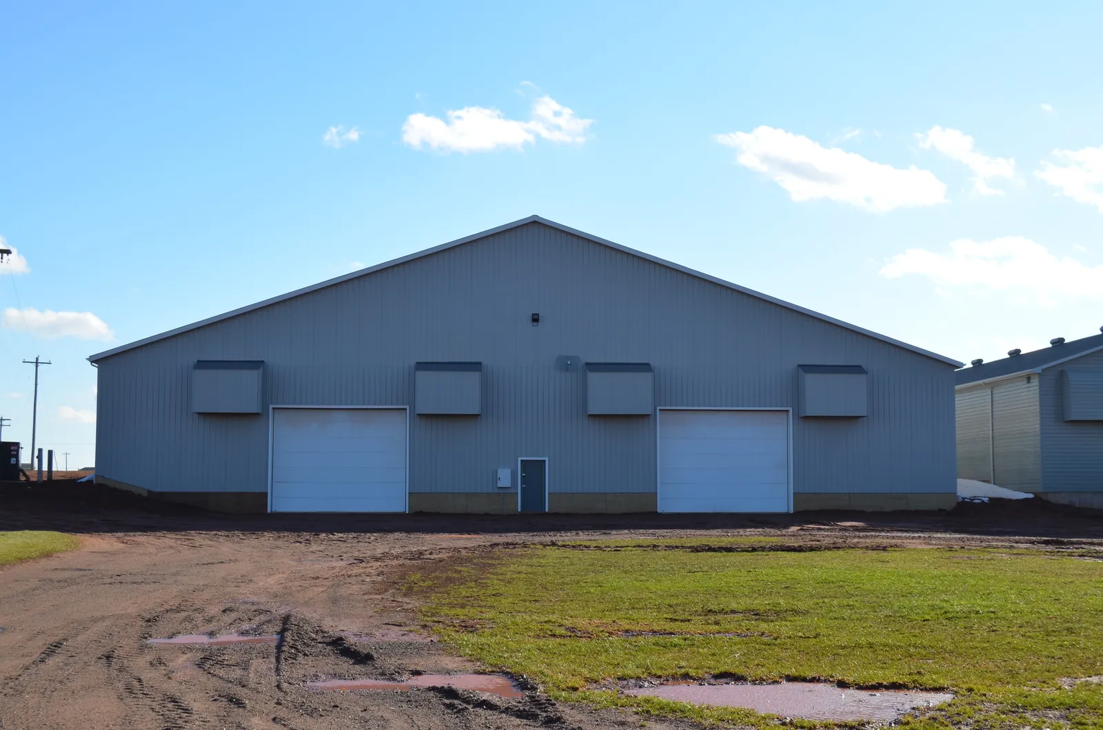 The finished grey agricultural building at Shorelane Farms